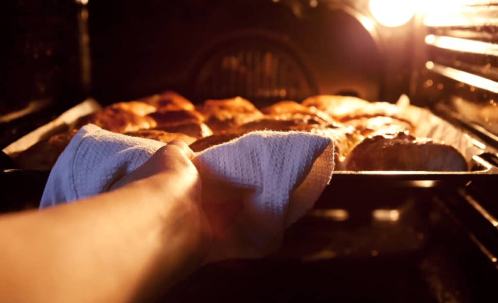 Ready apple pies taken out of the hot oven