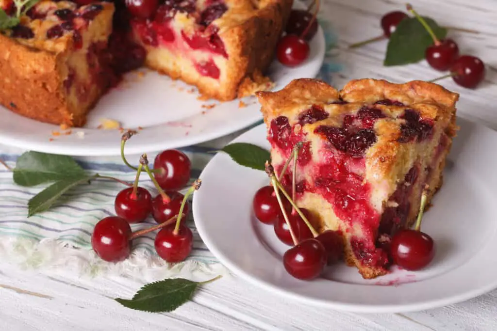 Slice of homemade cherry pie closeup. 