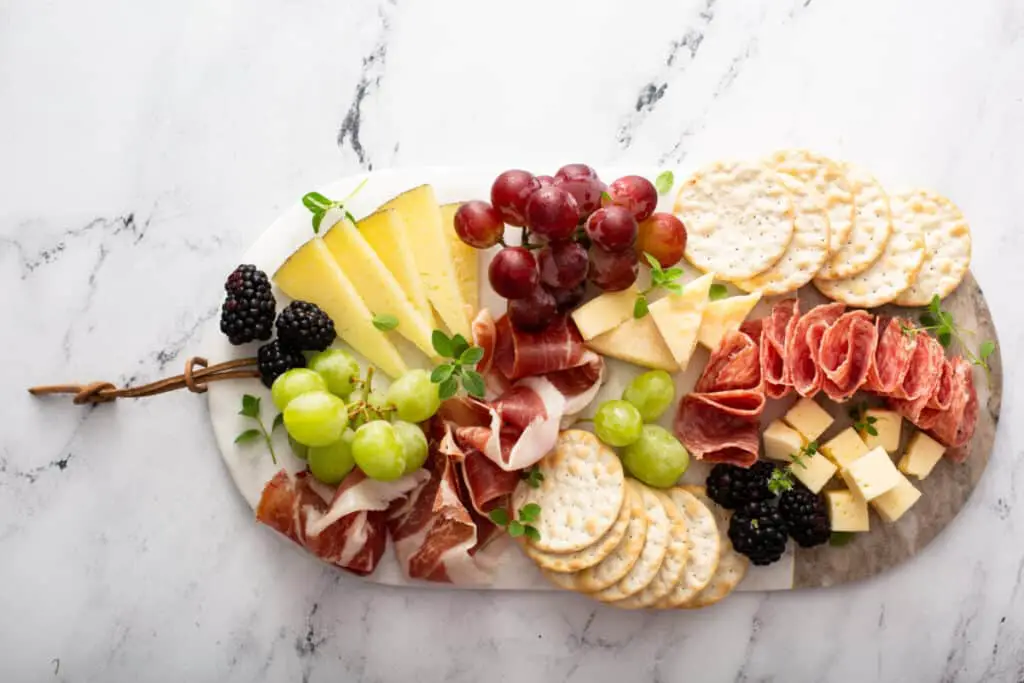 Charcuterie board with variety of cheese and meats