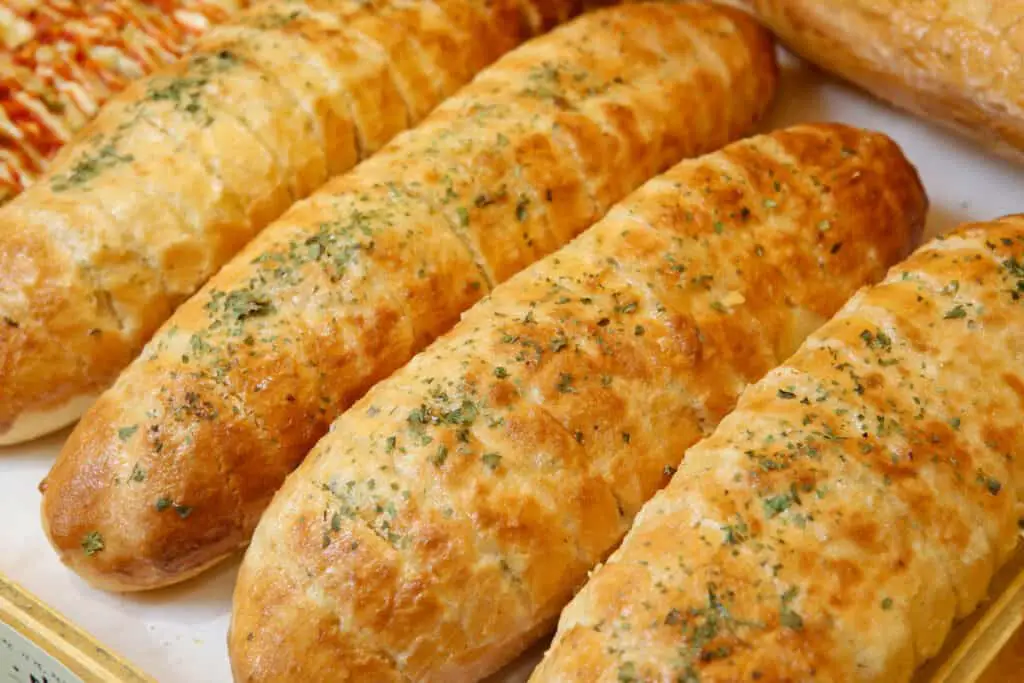 Baguette with garlic sauce and parsley