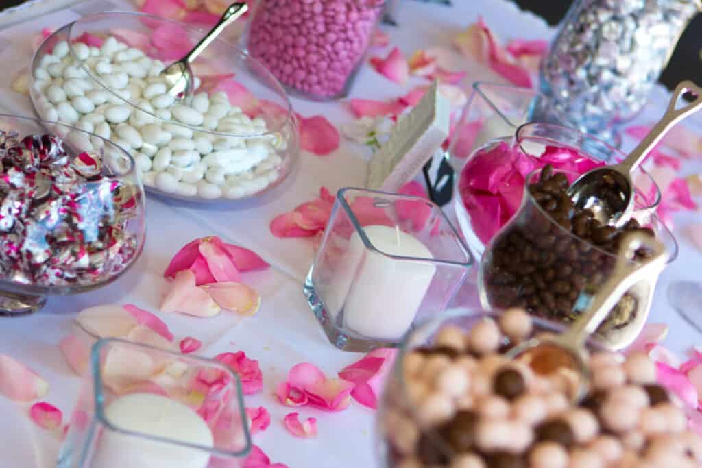 Colorful wedding candy table with chocolate goodies on display
