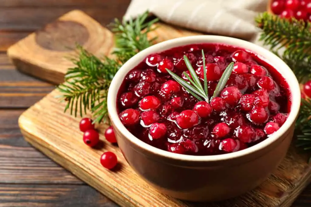 Fresh cranberry jam with rosemary twigs