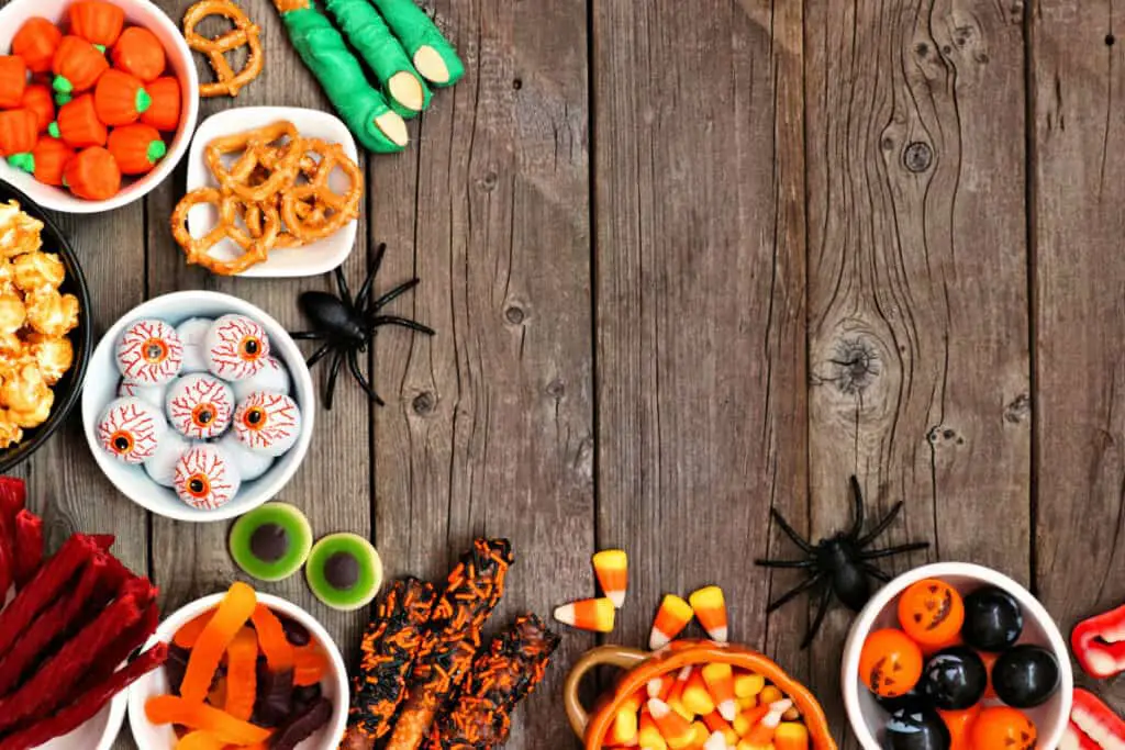 Halloween spooky candies on a wooden table