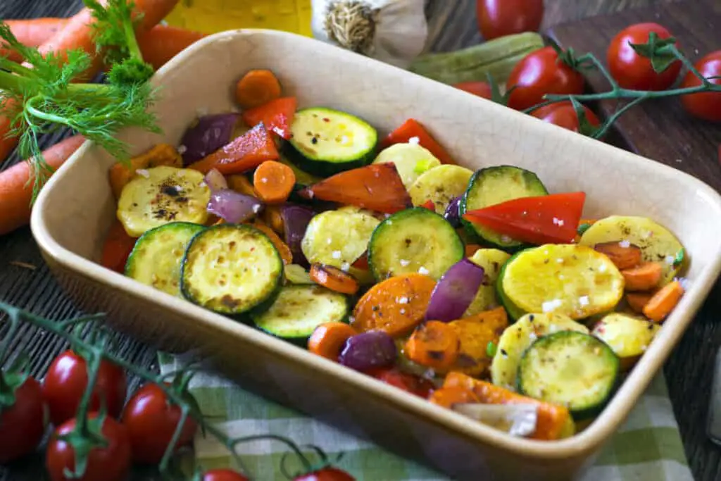 Roasted vegetables with olive oil in a dish