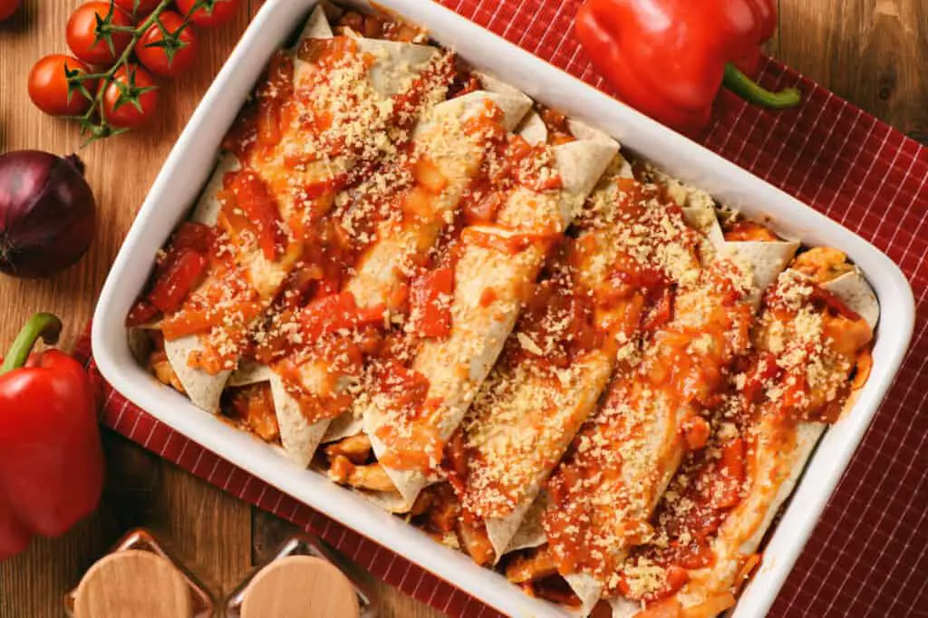 Enchiladas with chicken, cheese, and tomatoes