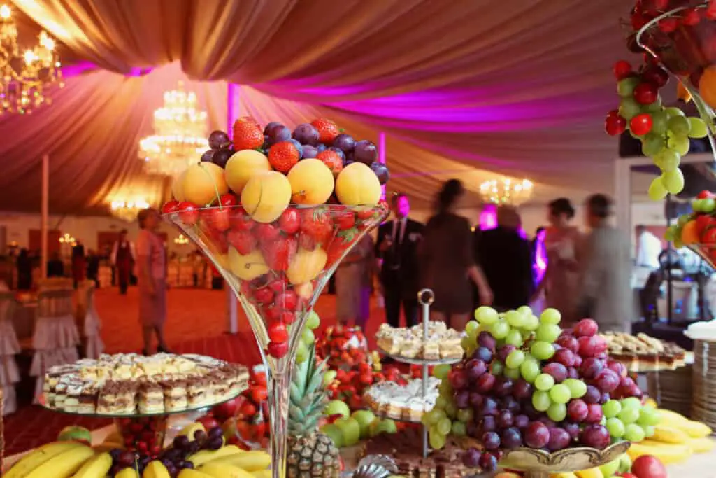 Fruit and dessert table at elegant wedding reception