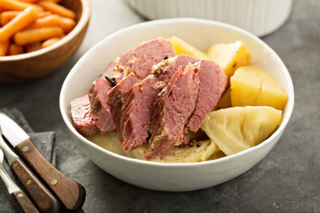 Corned beef and cabbage is a traditional Irish dinner that includes serving the brisket alongside boiled cabbage and often other vegetables like potatoes or carrots