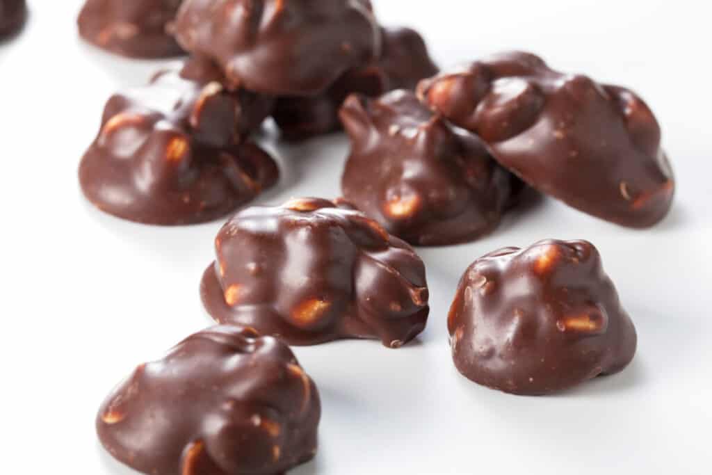 Chocolate peanut butter clusters on a white background