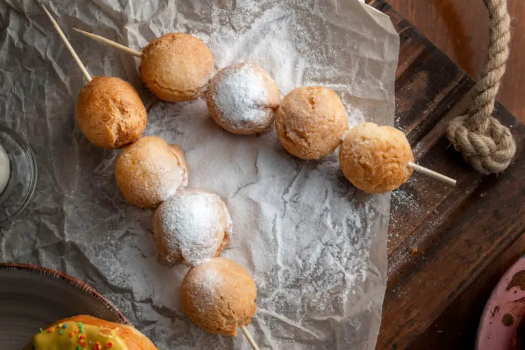 Powdered donut holes on skewers