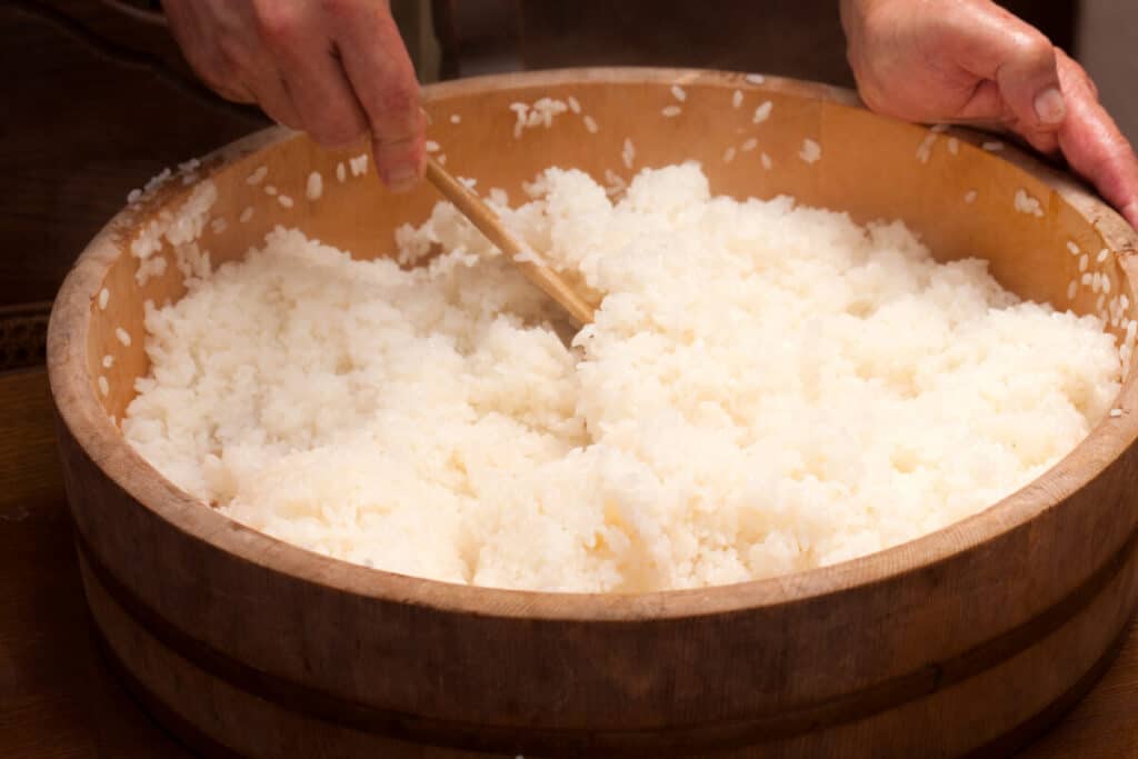 Sushi rice in a wooden bowl