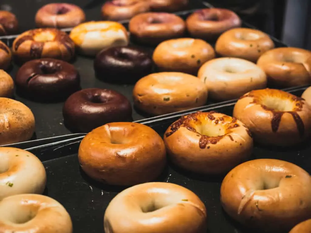 Variety of fresh bagels at a bakery