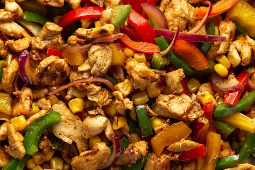 Chicken fajita meat with green and red bell peppers and red onions