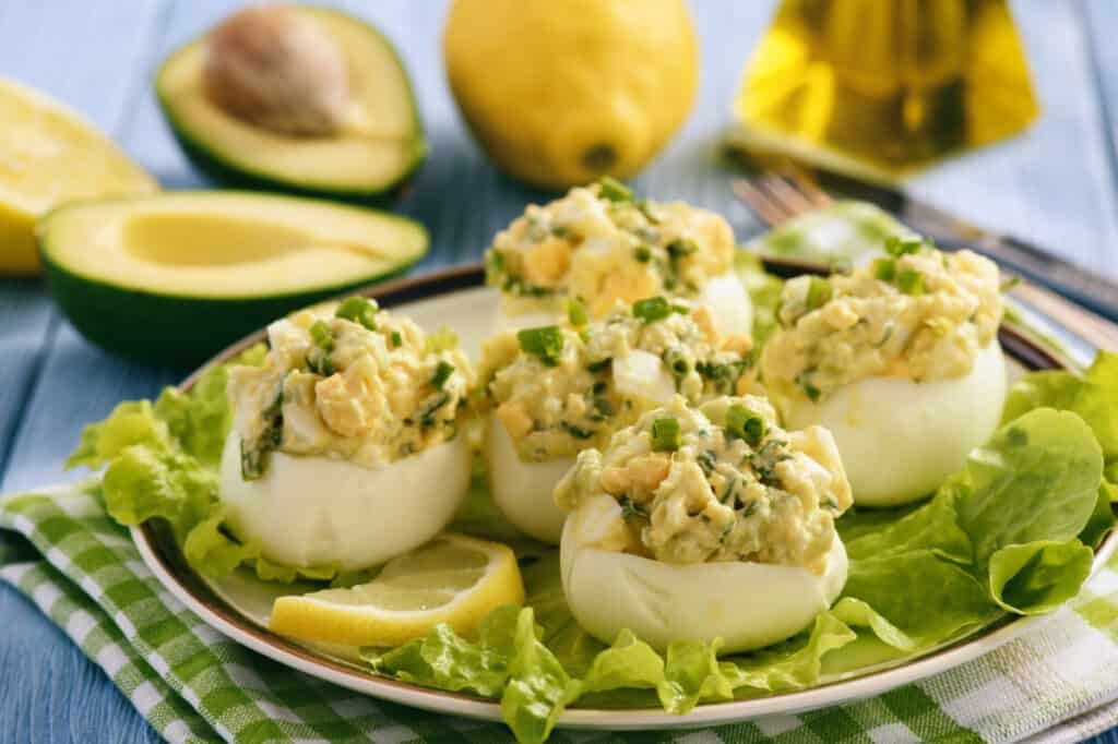 Deviled eggs with chives and avocado