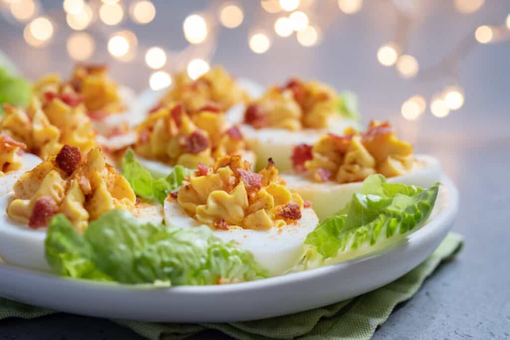 Deviled eggs with smoked paprika, bacon, and basil