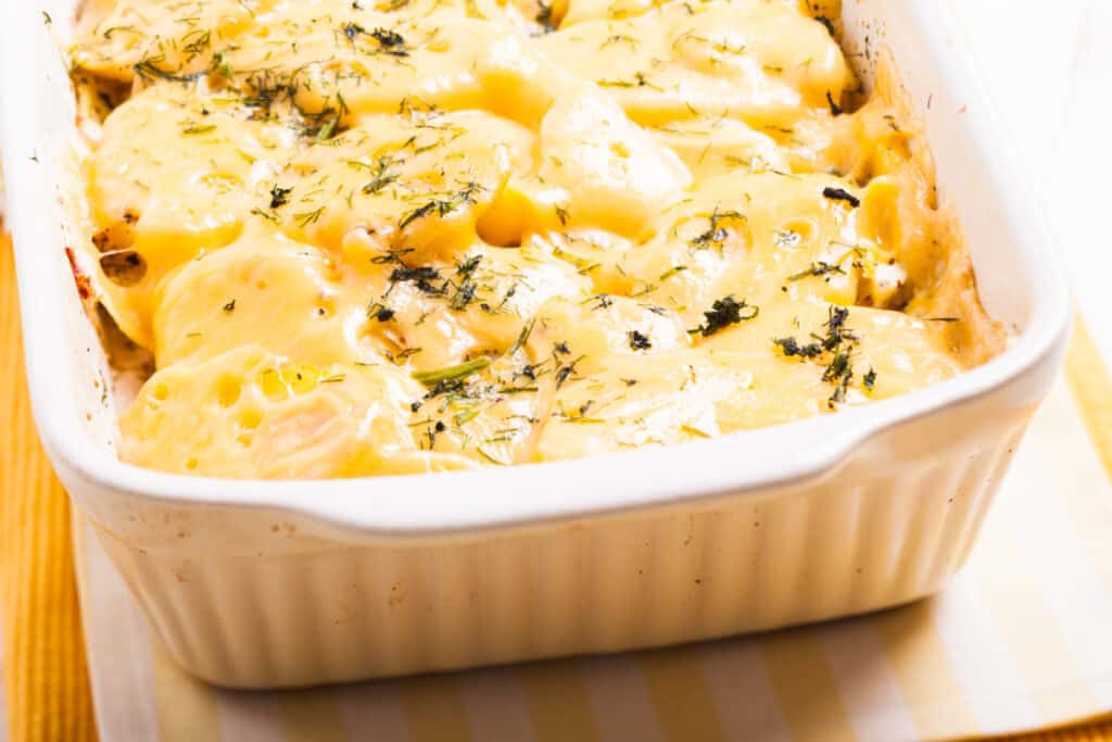 Funeral potatoes baked with cheese and herbs