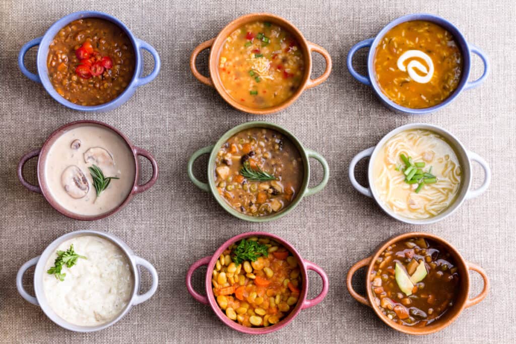 Colorful bowls of various types of soups