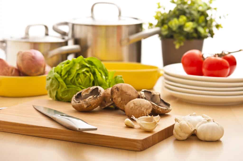 Mushrooms in a kitchen on a wooden cutting board