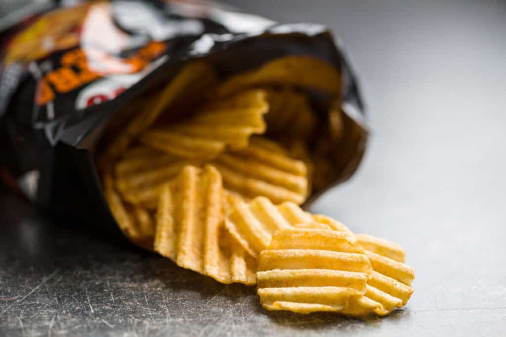 Open bag of ruffle potato chips