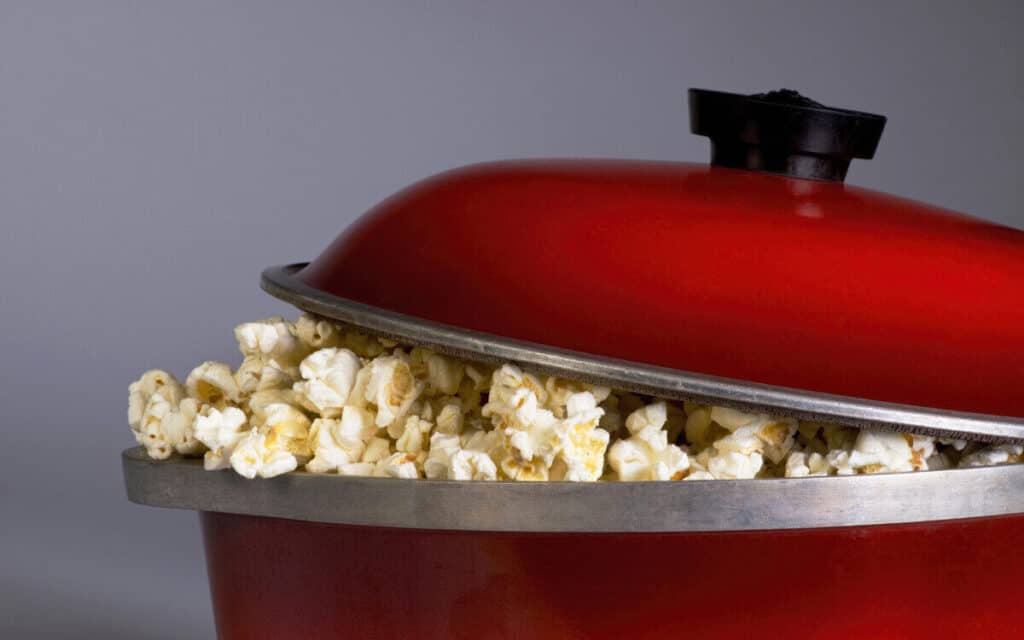 Popcorn coming out of a popcorn maker