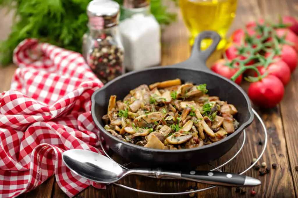 Mushrooms in a kitchen on a wooden cutting board