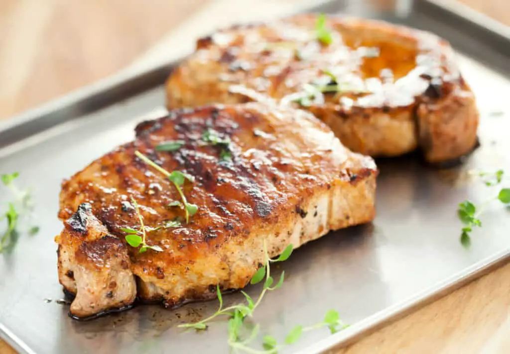 Glazed pork chops on a tray