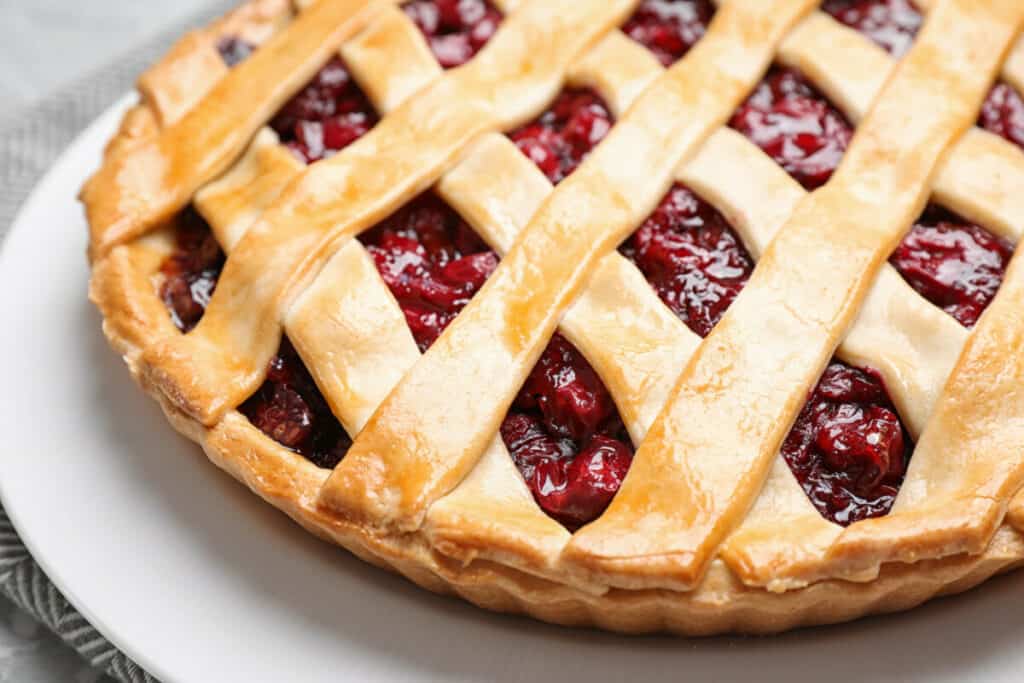 Close-up of cherry pie on a white plate