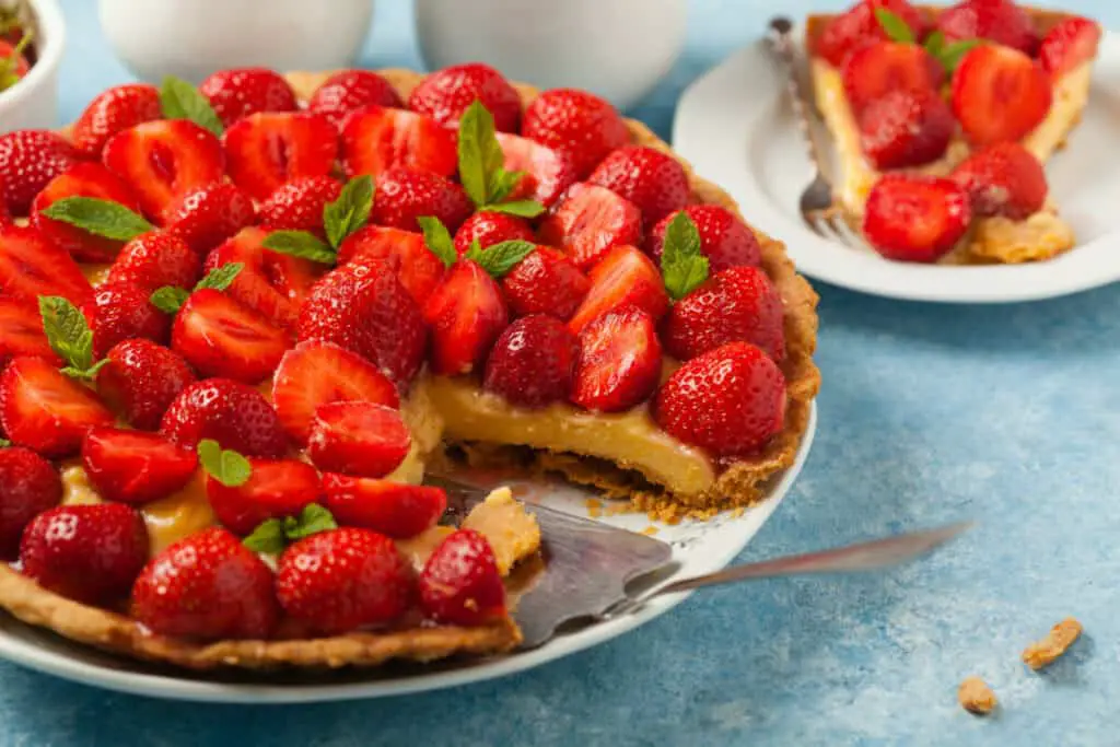 Fresh strawberry pie with a piece cut out