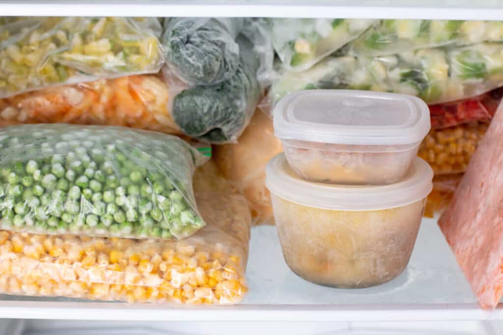Frozen vegetables, soup, and ready meals in the freezer