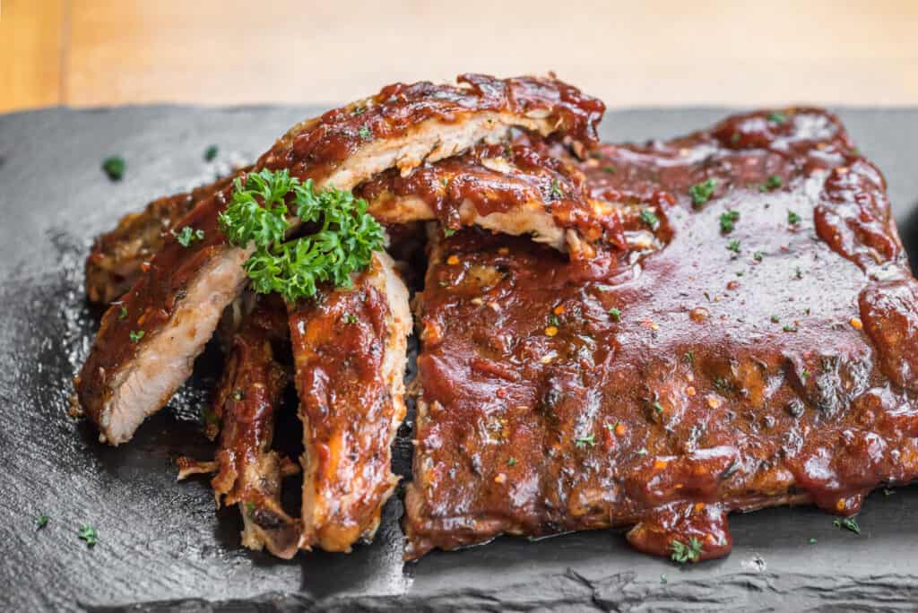 Grilled barbecued pork baby back ribs