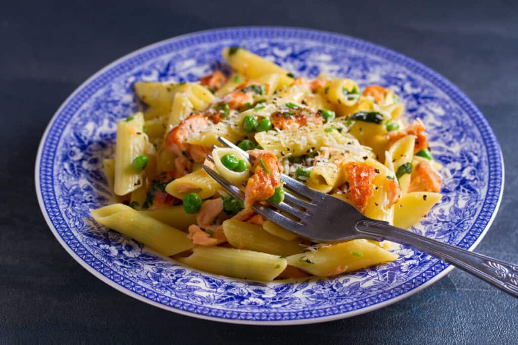 Creamy salmon penne pasta with green peas