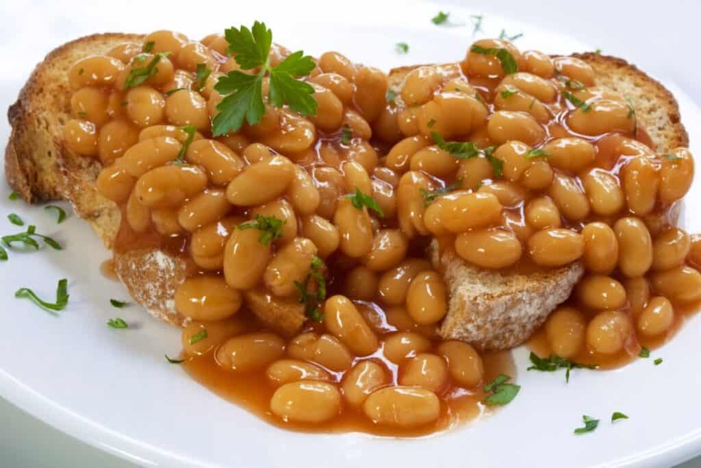 Baked beans on sourdough toast, garnished with parsley