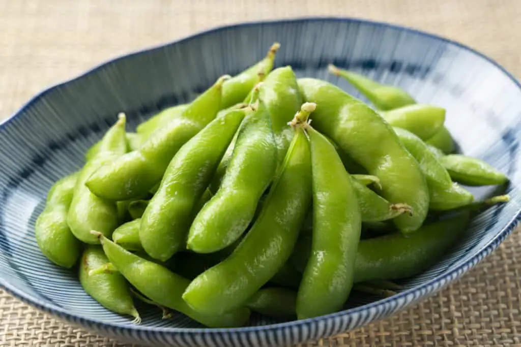Edamame in a small blue bowl.