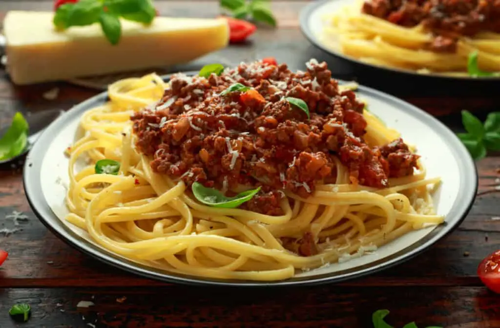 Italian pasta bolognese with beef, basil, and parmesan cheese.