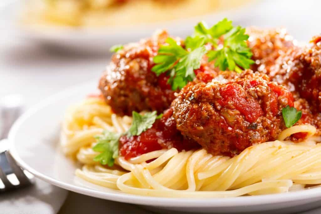 Spaghetti noodles with tomato sauce and meatballs.