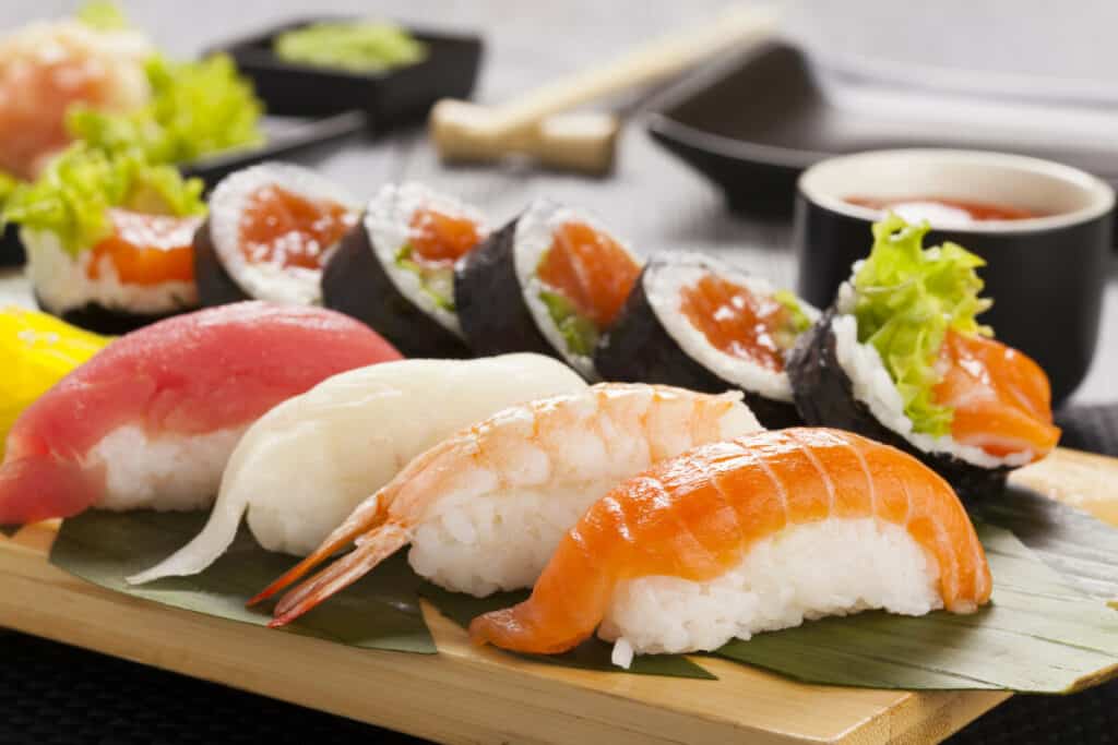 Nigiri sushi with tuna, salmon, shrimp, and butterfish on rice.