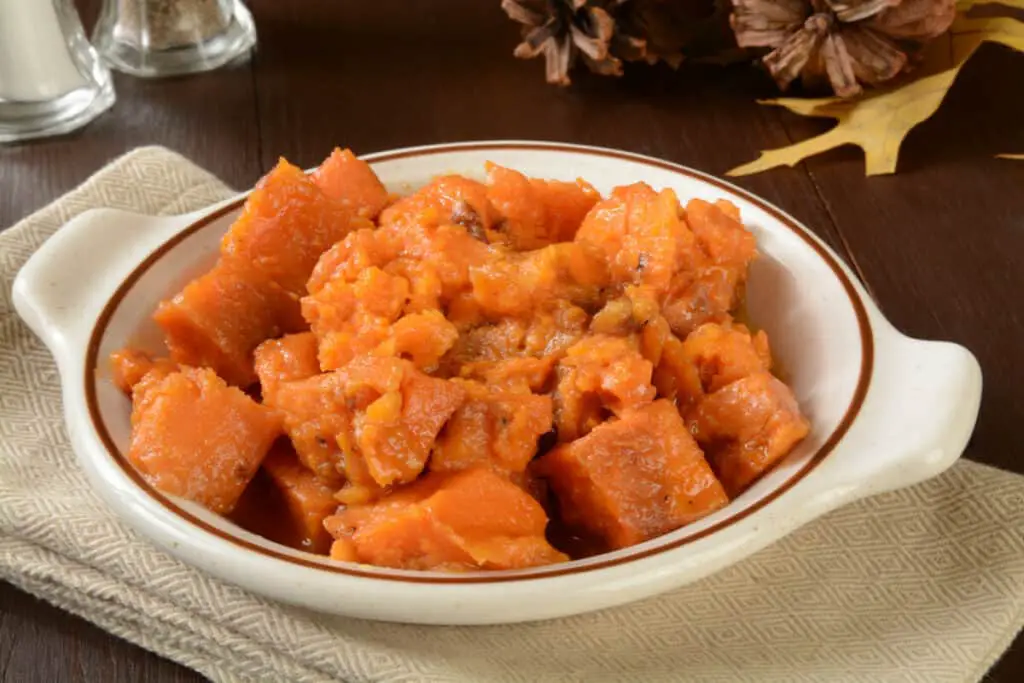 Sweet potatoes cooked in maple syrup with pecans.