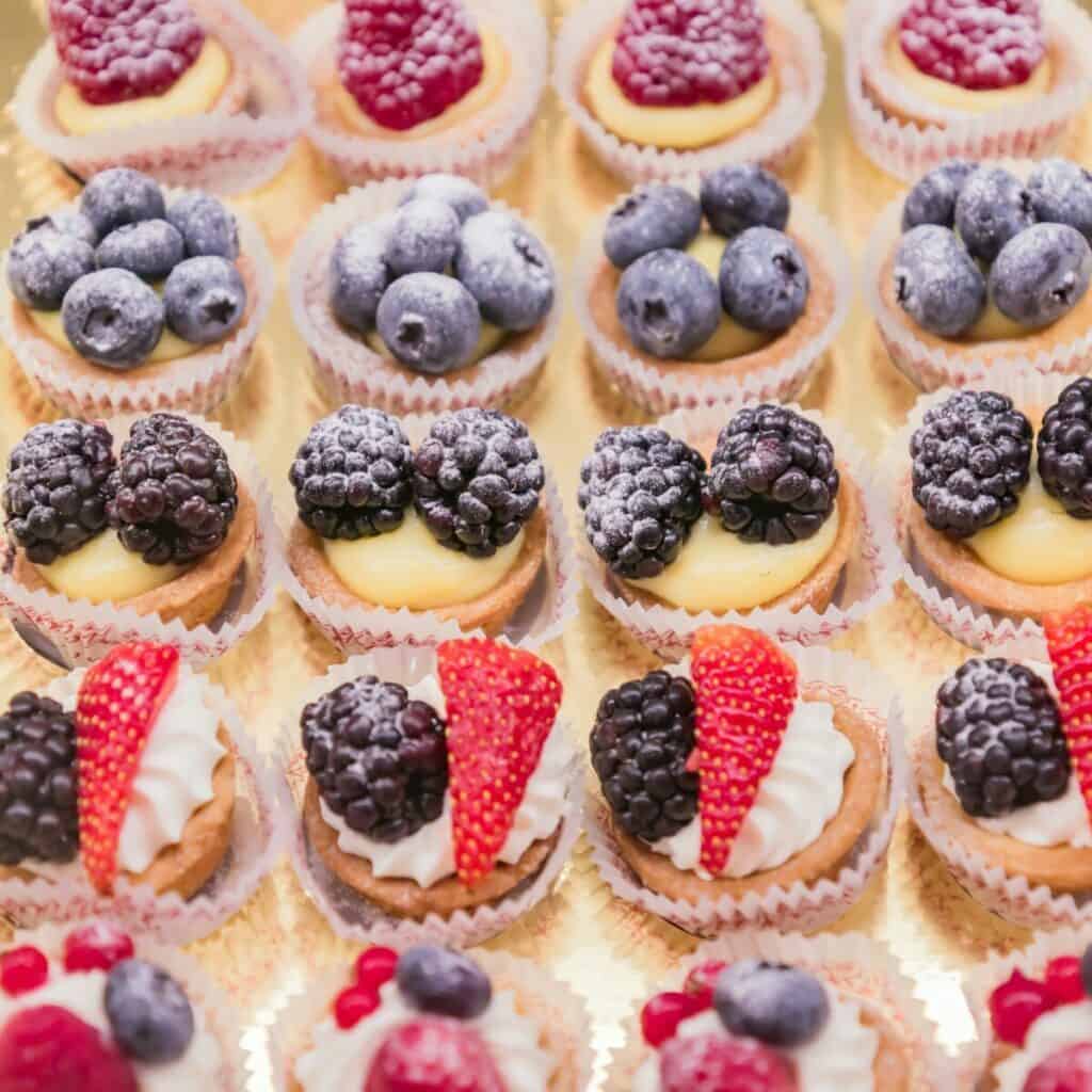 Mini tarts with strawberries, blueberries, blackberries, and raspberries.