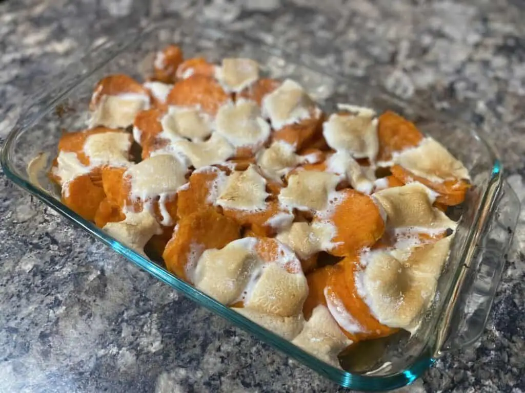 Baked sweet potato casserole with marshmallows.