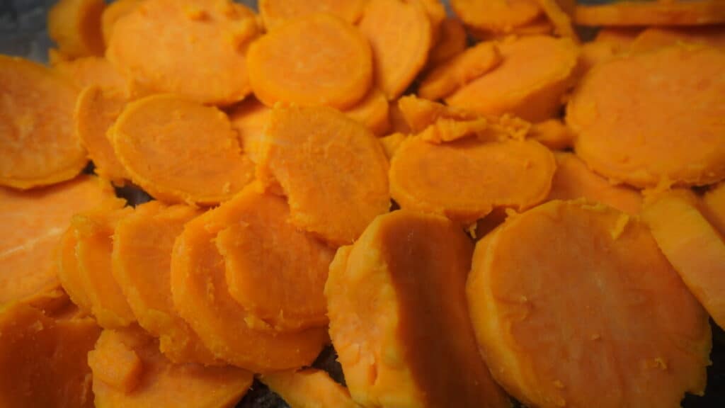 Close-up of baked and sliced sweet potatoes.